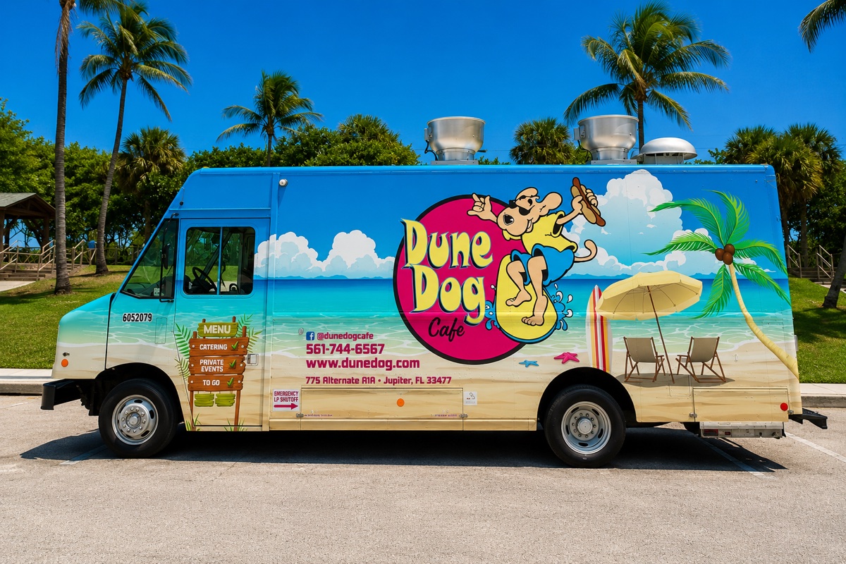 The Dune Dog Cafe food truck parked by palm trees
